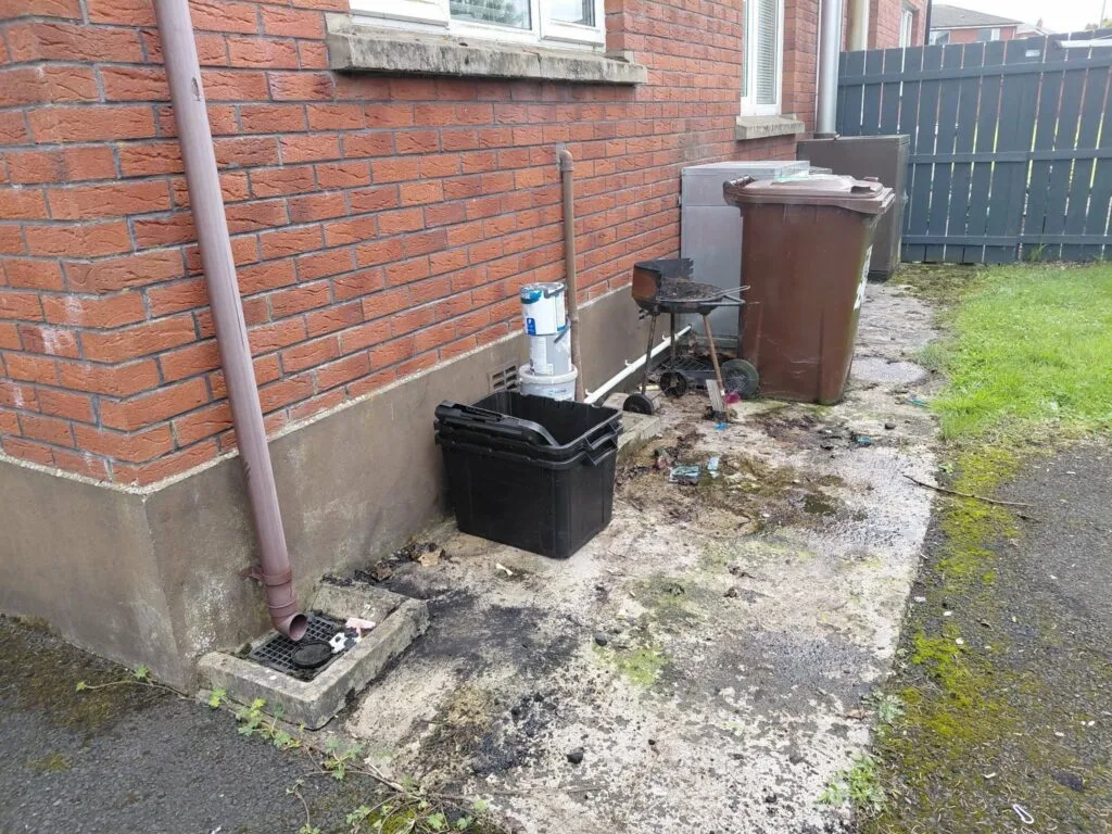 Area beside the Ballymena property after the household waste clearance